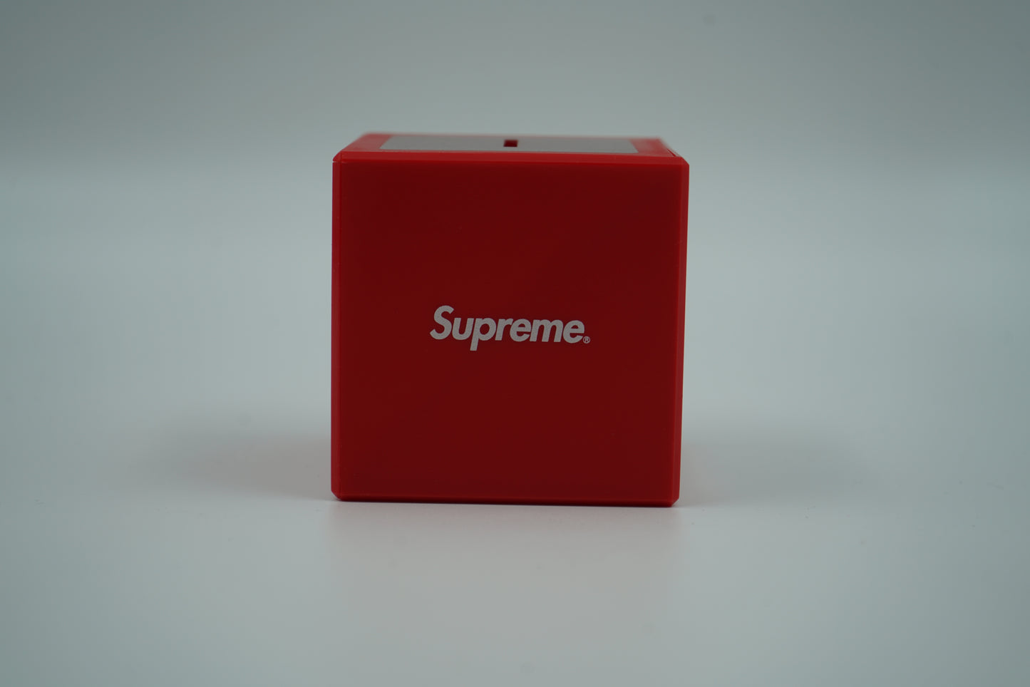 Supreme Red Illusion Coin Bank