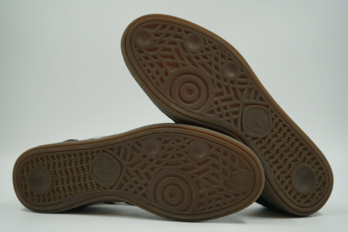 Gum rubber outsoles of pre-owned adidas Handball Spezial with light wear, showing tread pattern