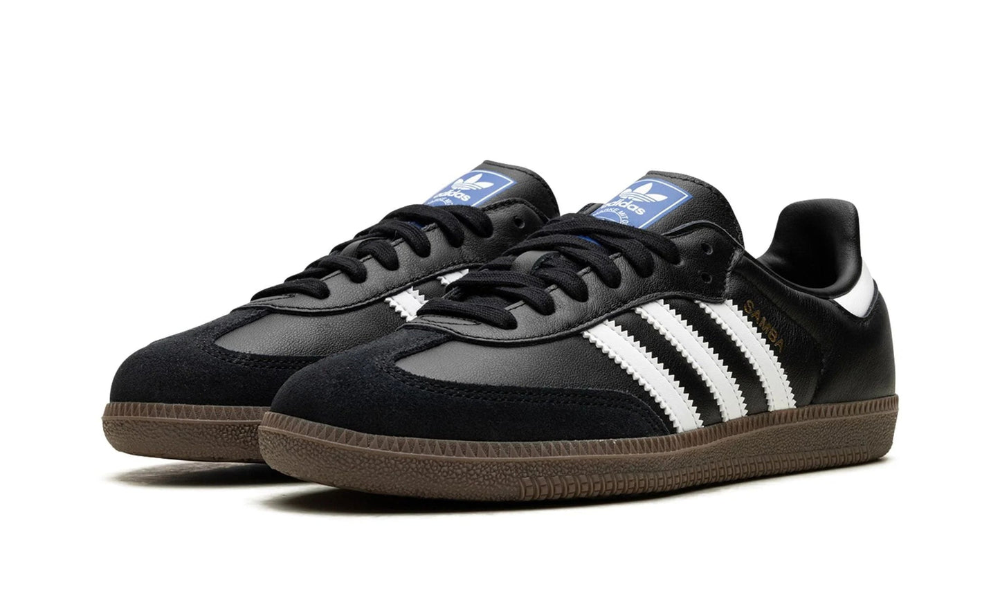 Classic Adidas Samba OG Black Gum (B75806) featuring core black leather, white stripes, and a gum rubber sole. Available at our Malmö store