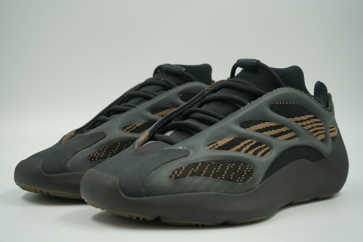 Pre-owned pair of adidas Yeezy 700 V3 Clay Brown with translucent cage and black laces, front view