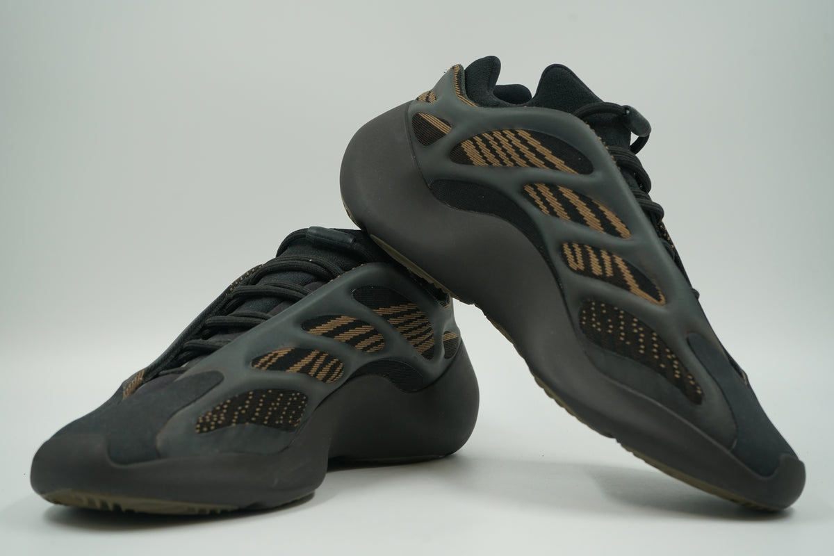 Pre-owned pair of adidas Yeezy 700 V3 Clay Brown with black cage and brown knit upper, side view