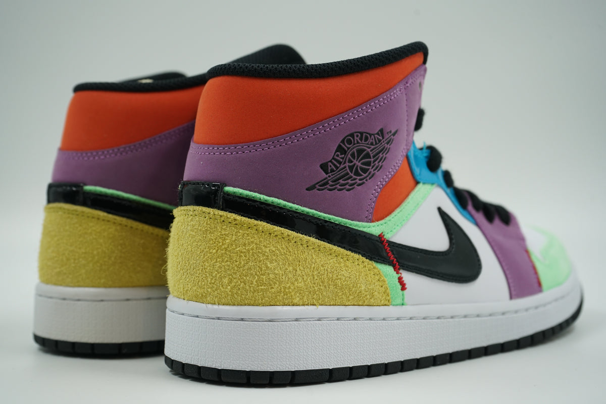 Pair of pre-owned women’s Air Jordan 1 Mid SE Lightbulb, back view with yellow suede heel and Wings logo