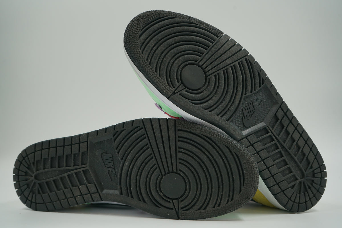 Pre-owned women’s Air Jordan 1 Mid SE Lightbulb, outsole view with black rubber tread and Nike logo