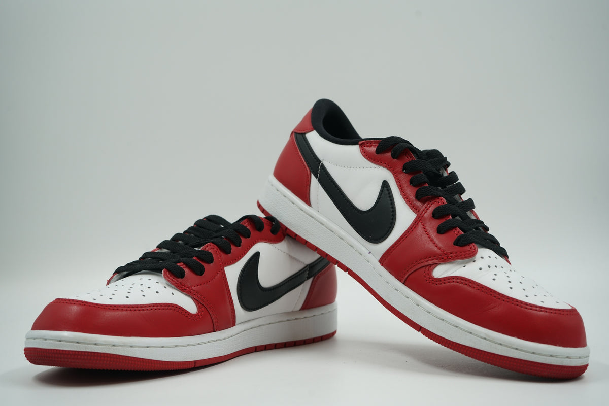 Pair of pre-owned Air Jordan 1 Retro Low OG Chicago 2025, stacked view of inner sides with black Swoosh