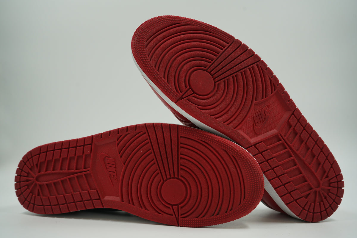 Pre-owned Air Jordan 1 Retro Low OG Chicago 2025, outsole view with red tread and Nike logo