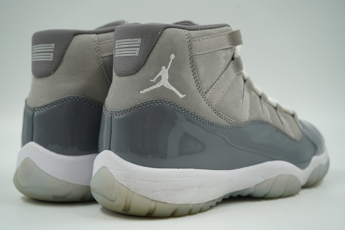 Pre-owned Air Jordan 11 Cool Grey 2021 with white Jumpman and 23 on heel, grey patent leather, rear view