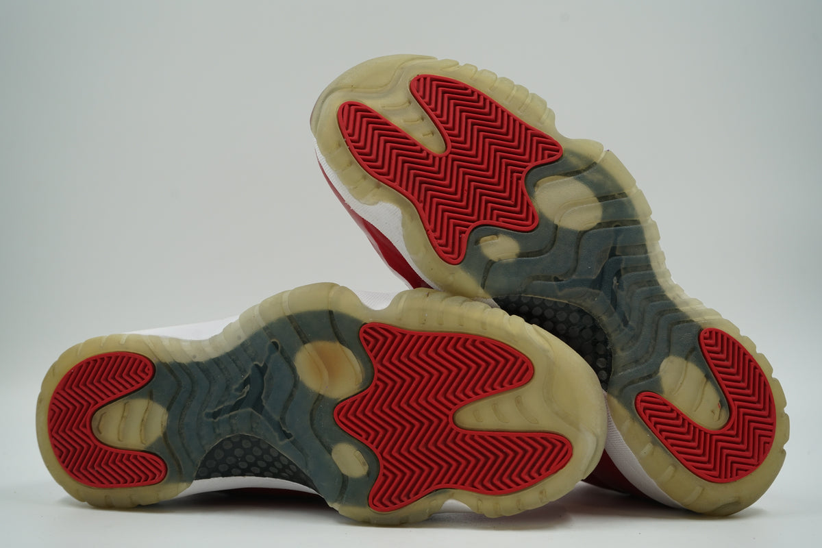 Pre-owned Air Jordan 11 Retro Win Like 96 in Gym Red, outsole view with red herringbone tread and icy sole