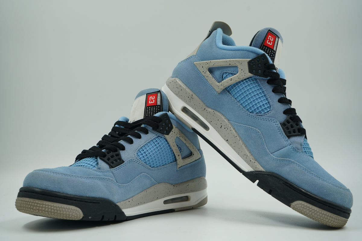 Pair of pre-owned Air Jordan 4 Retro University Blue, stacked view of inner sides with red 23 tongue tags