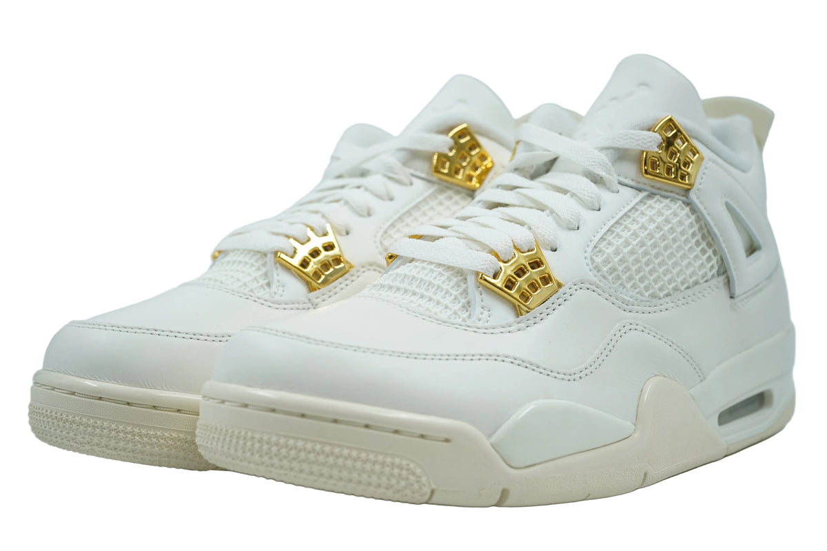 Brand new pair of women's Air Jordan 4 Metallic Gold in sail leather with gold eyelets, front view