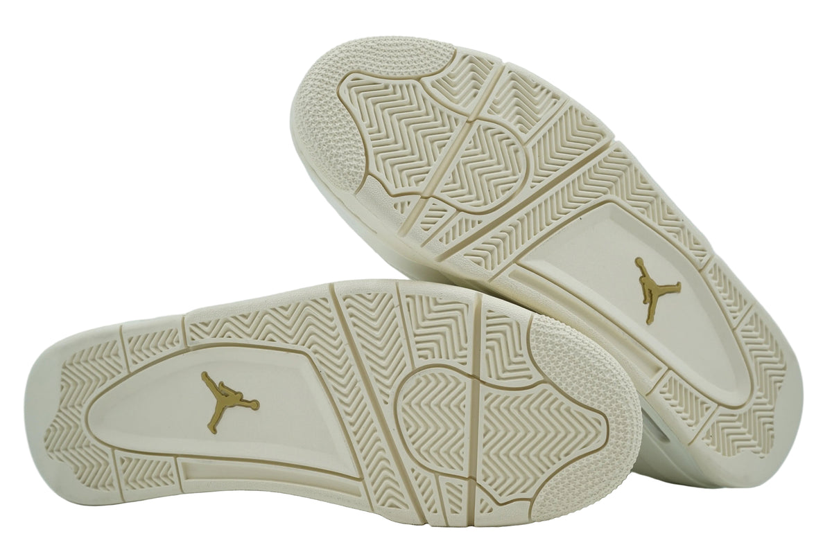 Unworn sail outsoles of women's Air Jordan 4 Metallic Gold with gold Jumpman logo