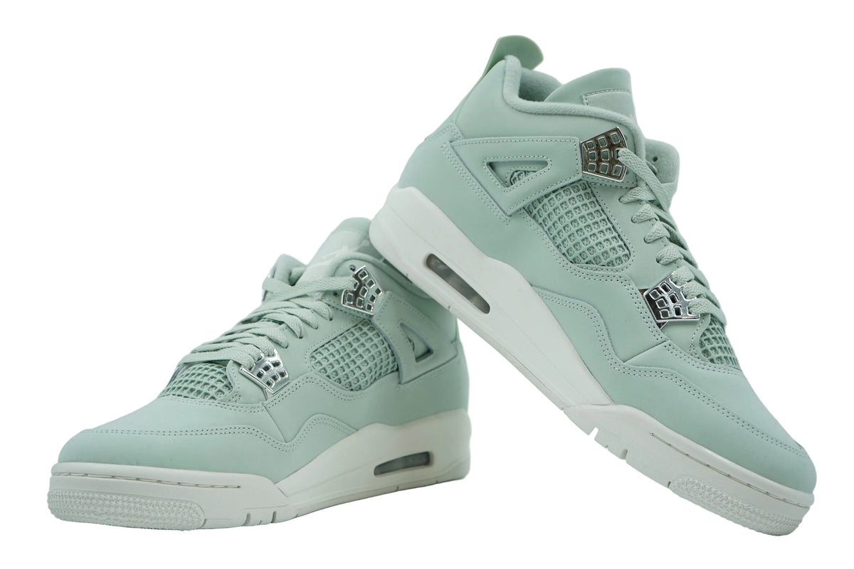 Brand new pair of women's Air Jordan 4 Seafoam in mint nubuck with silver eyelets and sail midsole, side view