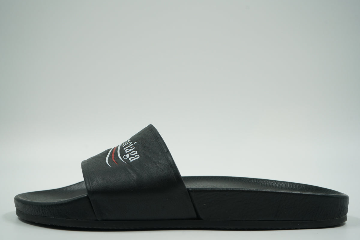 Pre-owned Balenciaga pool slide in black with white and red Political Campaign logo, side view