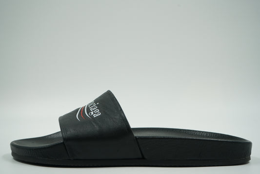 Pre-owned Balenciaga pool slide in black with white and red Political Campaign logo, side view