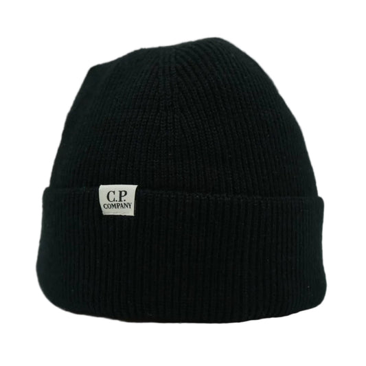 C.P. Company ribbed knit beanie in black with white logo label on cuff, front view