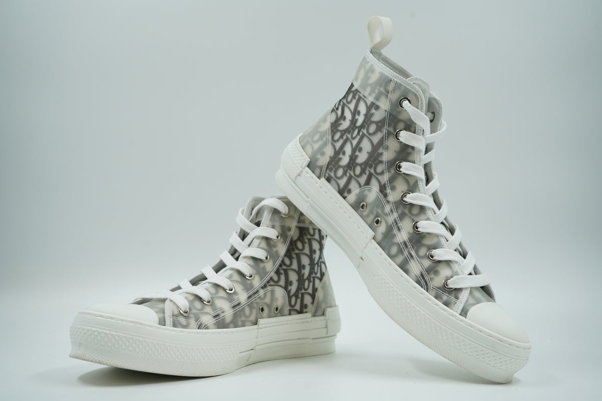 Pair of pre-owned Dior B23 high-top sneakers in Dior Oblique canvas, stacked view showing inner sides