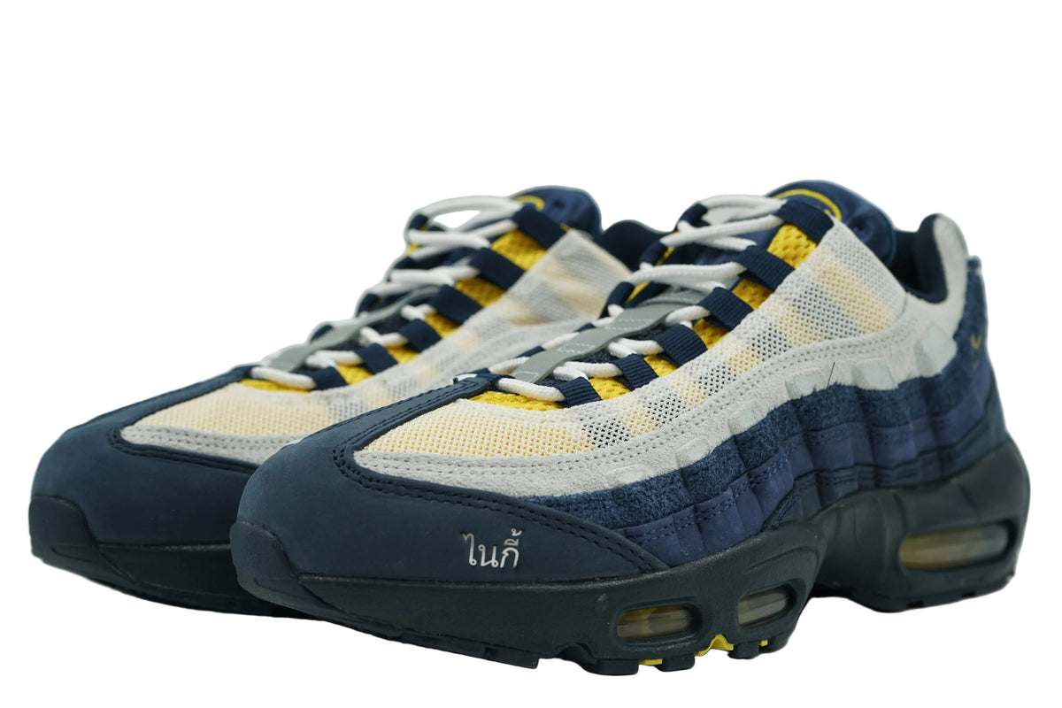 Pair of brand new Eric Koston x Nike SB Air Max 95 in navy and grey suede with Thai Nike script at toe, front view