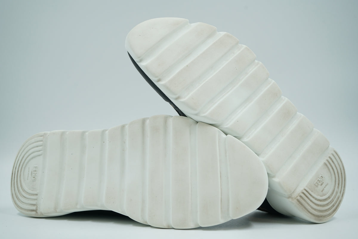Pre-owned Fendi slip-on sock sneakers, white ridged outsole view with embossed Fendi Roma Made in Italy logo