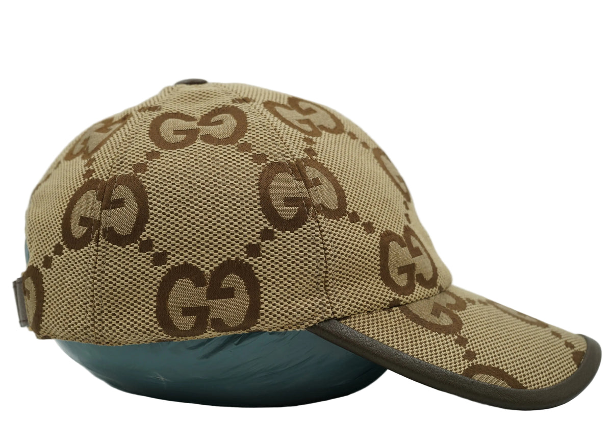 Gucci Jumbo GG canvas baseball cap in beige and brown with leather-trimmed peak, side profile view