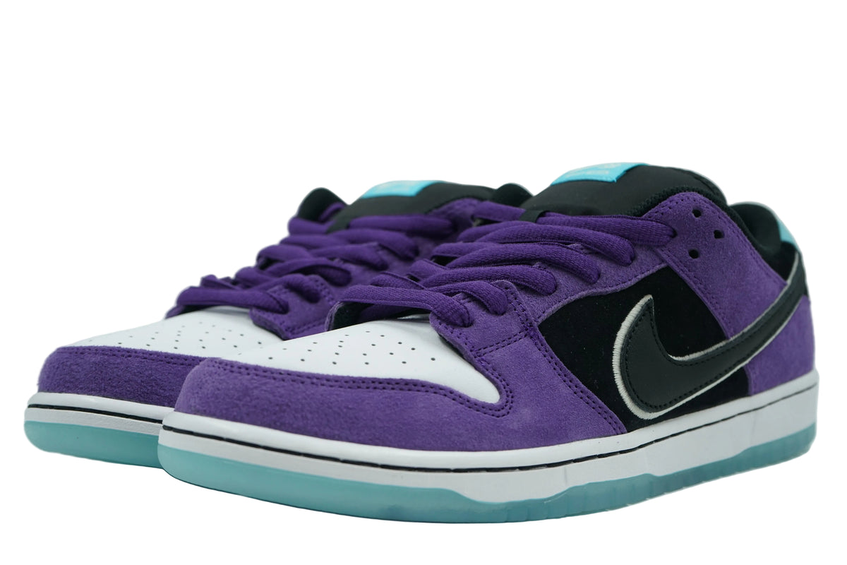 Pair of Hayley Wilson x Nike SB Dunk Low Court Purple with purple suede, white toe and icy blue soles, front view