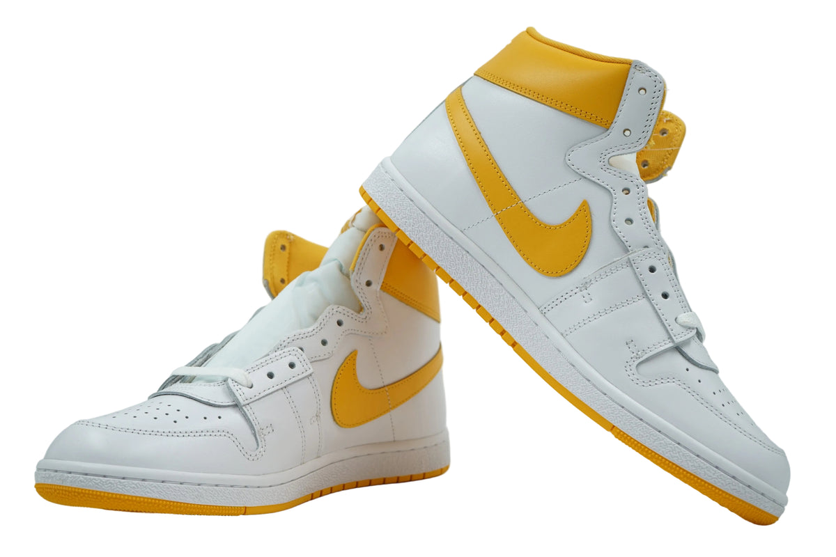 Pair of Jordan Air Ship PE SP University Gold in white leather with yellow Swoosh and outsole, side view