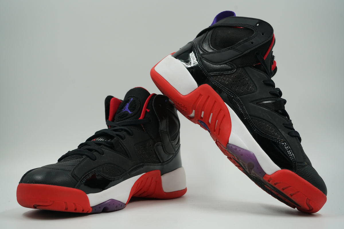 Pair of pre-owned Jordan Jumpman Two Trey in black, stacked view of inner sides with purple outsole detail