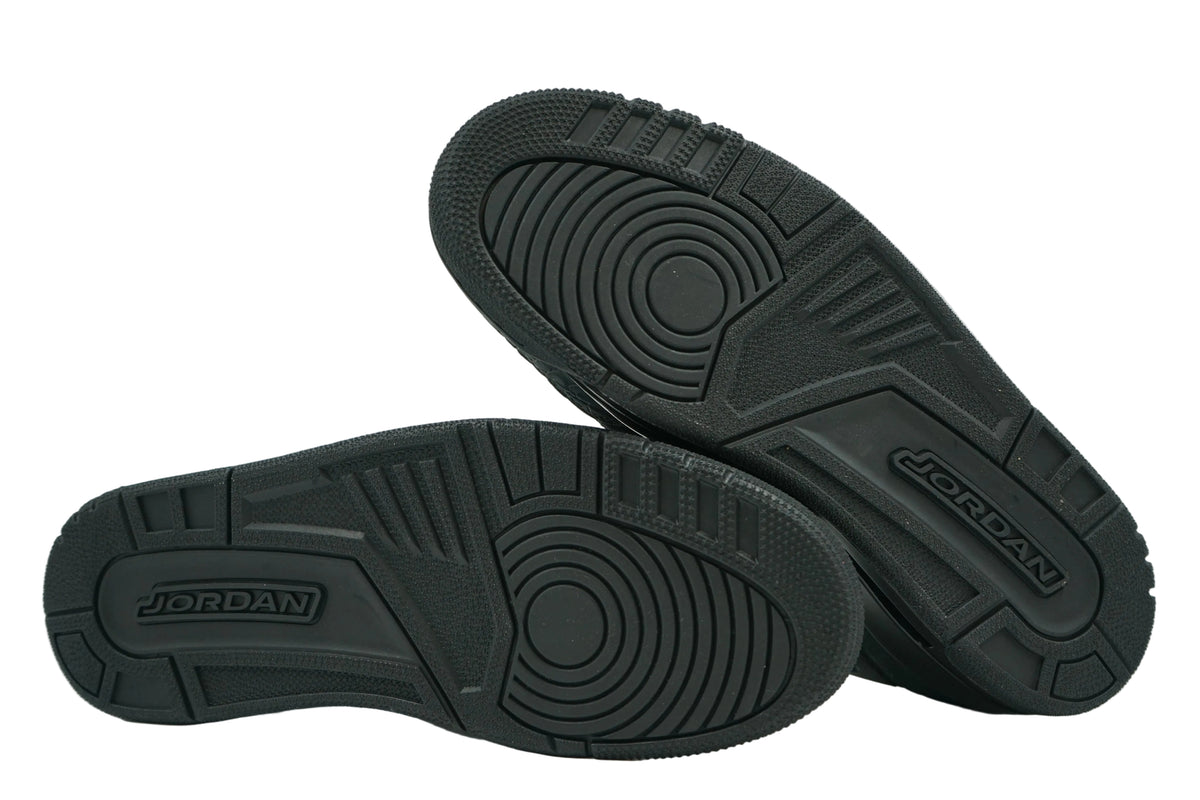 Unworn black outsoles of Jordan Spizike Low Black Cat with circular pivot tread and Jordan logo