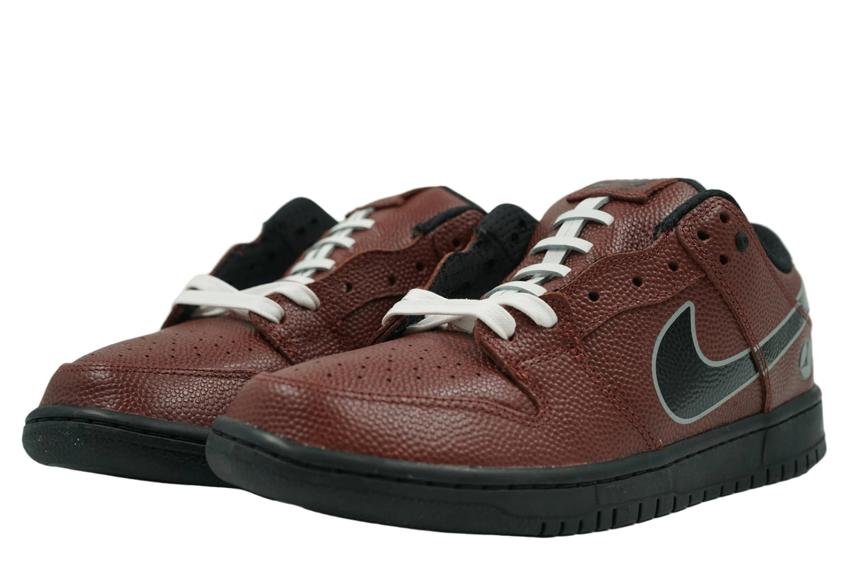 Pair of brand new Limosine x Nike SB Dunk Low Football with football-style white lacing on tongue, front view