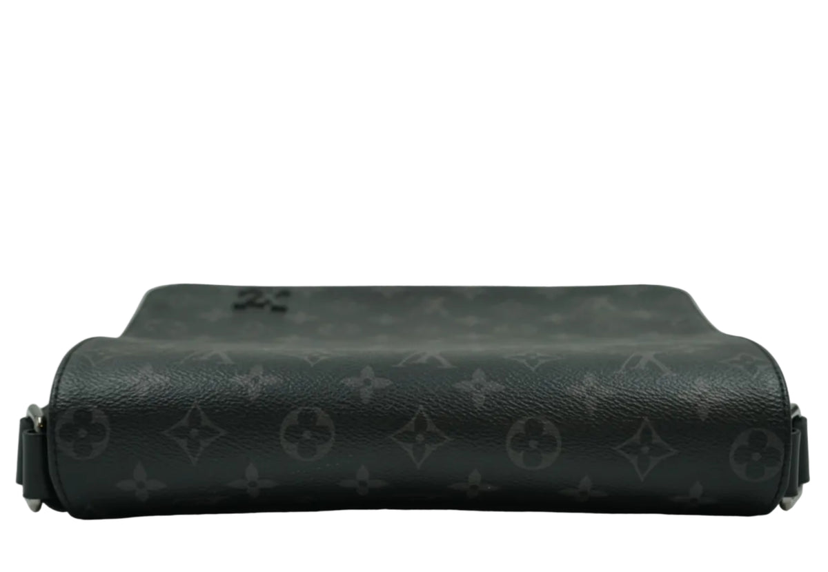 Top view of pre-owned Louis Vuitton District messenger in Monogram Eclipse showing flap fold and LV logo