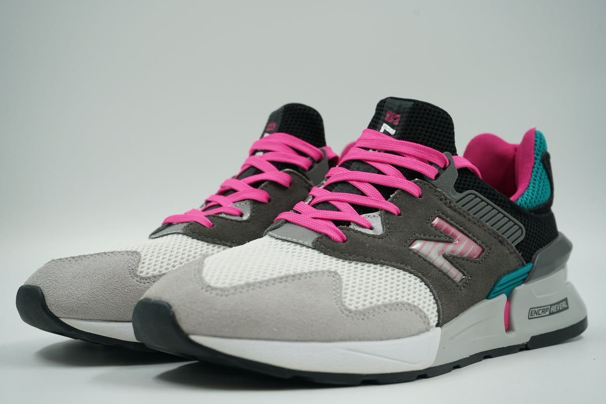 Pair of pre-owned New Balance 997 Sport Castlerock Amazonite with pink laces, front angle view