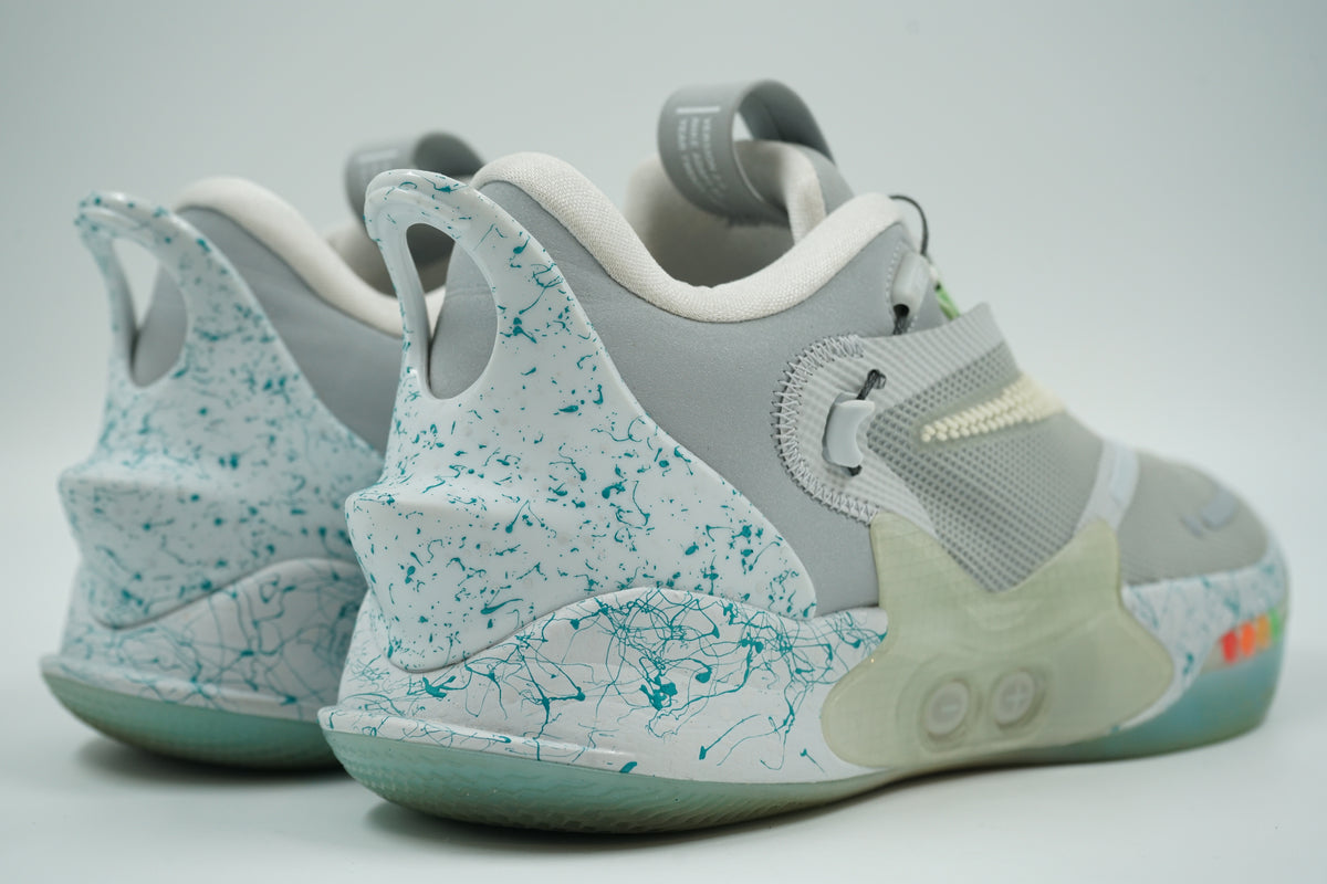 Pre-owned Nike Adapt BB 2.0 Mag with teal splatter heel counter, lacing buttons and LED lights, rear view