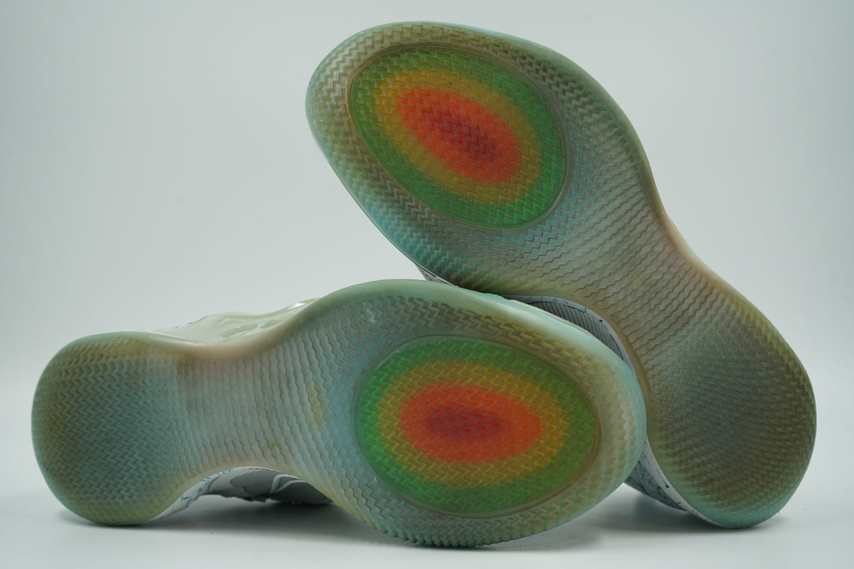 Outsoles of pre-owned Nike Adapt BB 2.0 Mag with icy translucent tread and rainbow heat map graphic