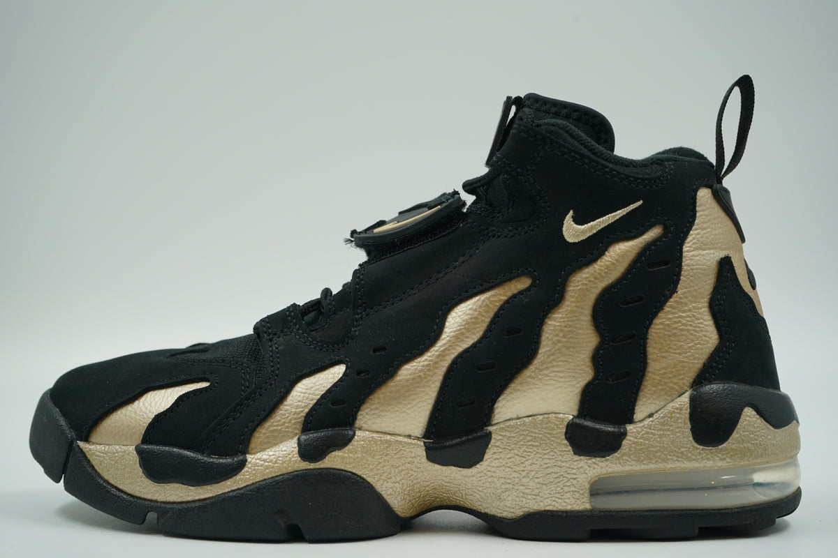 Pre-owned Nike Air DT Max 96 in black nubuck and metallic Vegas Gold with visible Air heel, side view