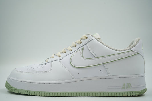 Pre-owned Nike Air Force 1 ‘07 Low in white with honeydew green outlined Swoosh and sole, side view