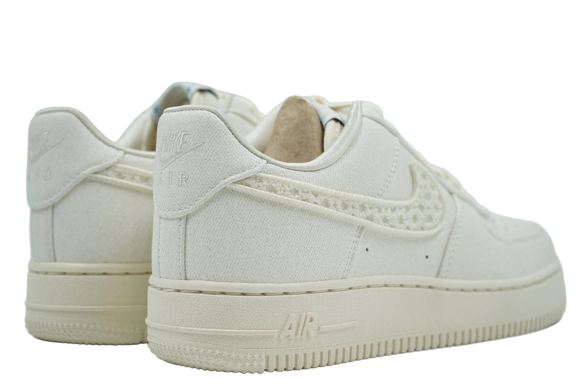 Brand new Nike Air Force 1 Low in sail canvas with embroidered Nike heel logo and cream sole, back view