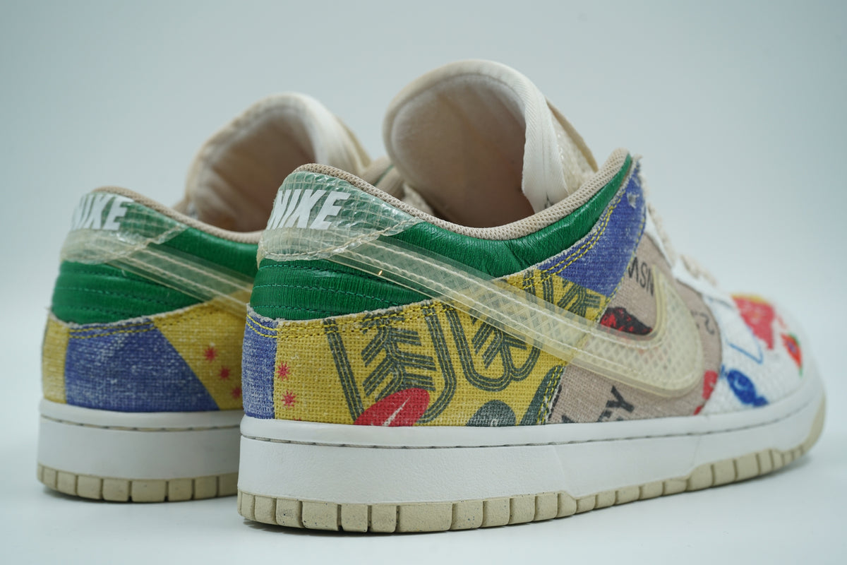 Pair of pre-owned Nike Dunk Low City Market sneakers, back view with translucent heel overlay and NIKE logo