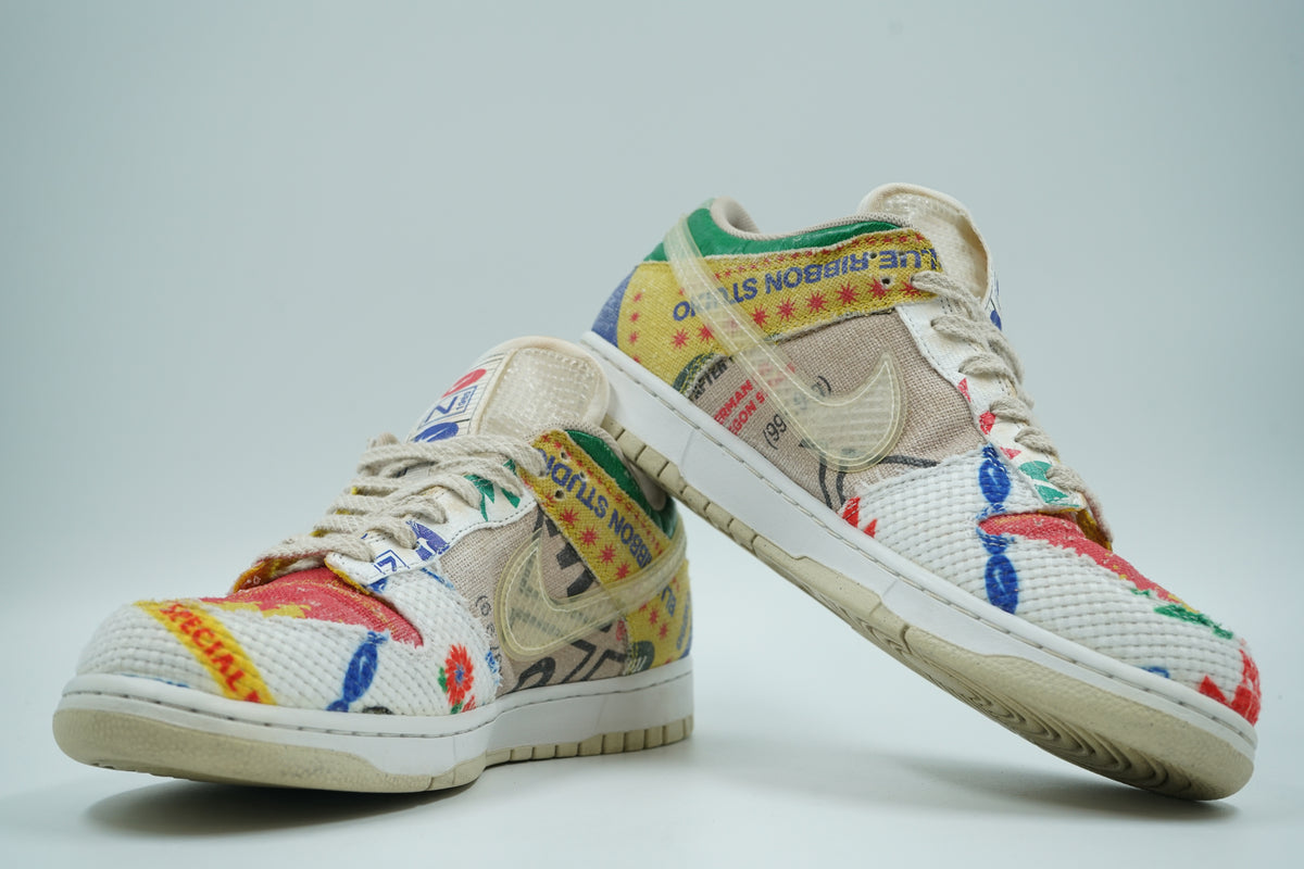 Pair of pre-owned Nike Dunk Low City Market sneakers, stacked view of inner sides with Blue Ribbon print