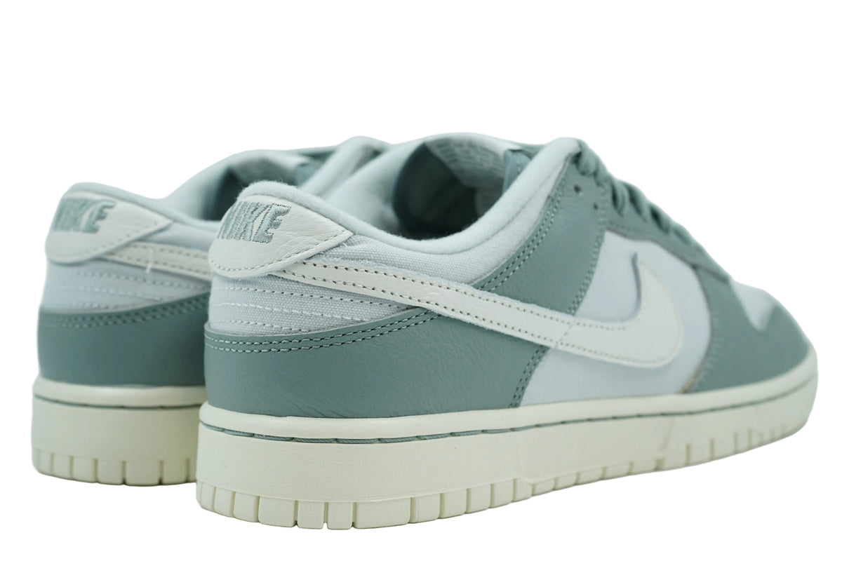 Nike Dunk Low Mica Green with embroidered Nike heel tab and green leather heel overlay, rear view