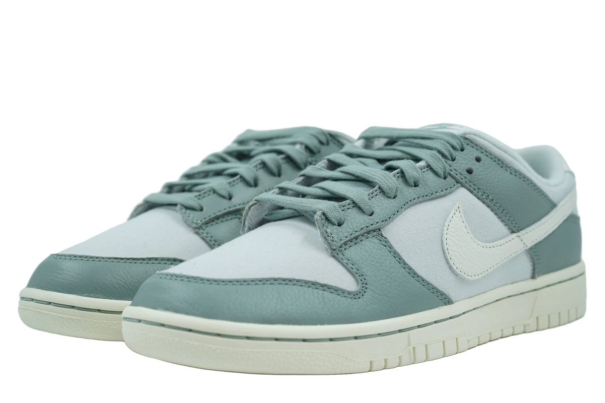 Pair of Nike Dunk Low Mica Green in green leather and grey canvas with sail Swoosh, front view