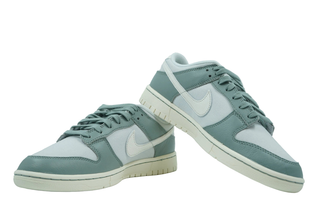 Pair of Nike Dunk Low Mica Green in green leather and grey canvas with sail sole, side view