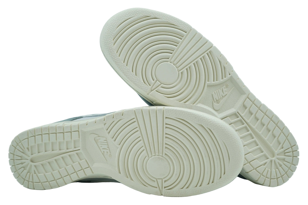 Clean sail outsoles of Nike Dunk Low Mica Green with pivot circle and Nike logo