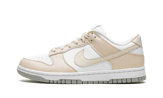 Nike Dunk Low Next Nature 'Light Orewood Brown' featuring a sustainable white and beige synthetic leather upper and a speckled grey Nike Grind outsole. Eco-friendly sneaker available at our Malmö store or order online now.