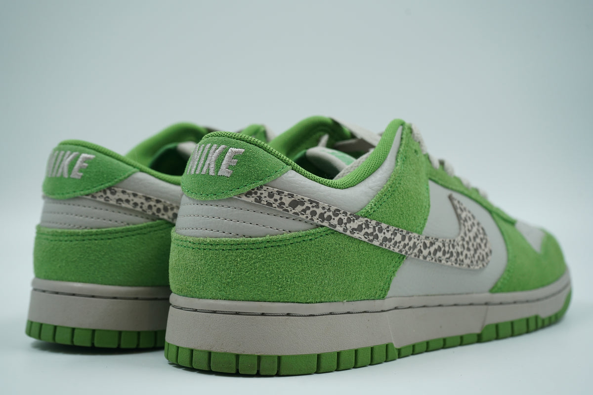 Pair of pre-owned Nike Dunk Low Safari Swoosh in green and grey, back view with embroidered Nike heel logo
