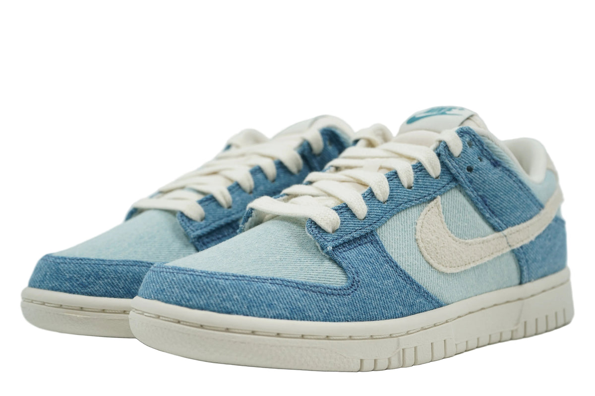 Pair of brand new Nike Dunk Low Smokey Blue Denim with cream laces and denim toe box, front view