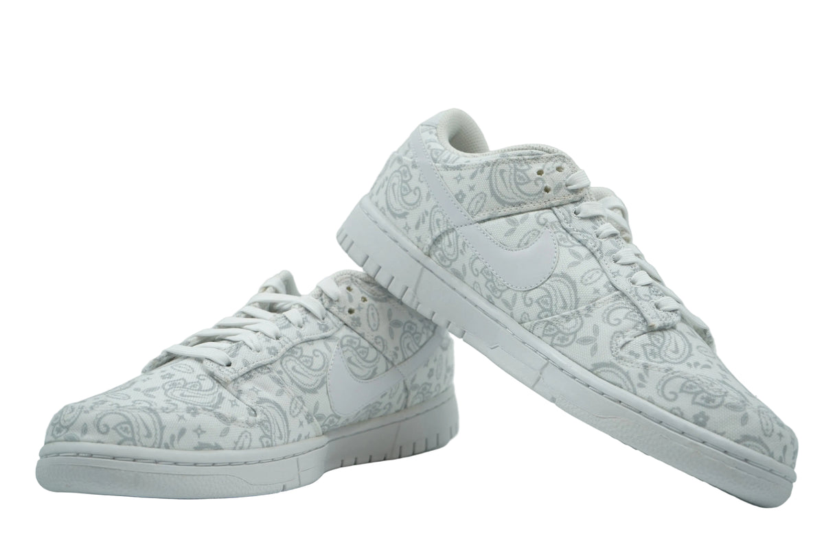 Pair of women's Nike Dunk Low White Paisley in white canvas with grey paisley print, side view