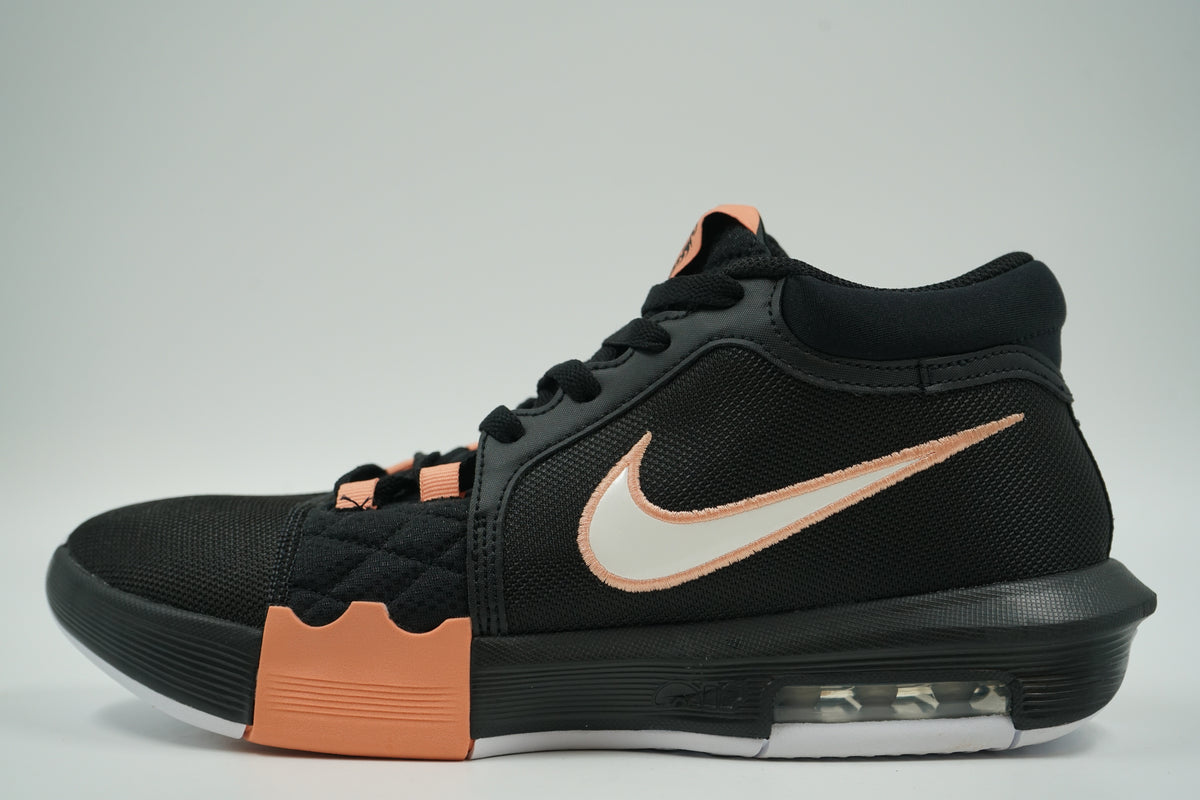 Pre-owned Nike LeBron Witness 8 in black with peach accents, white Swoosh and Max Air heel, side view