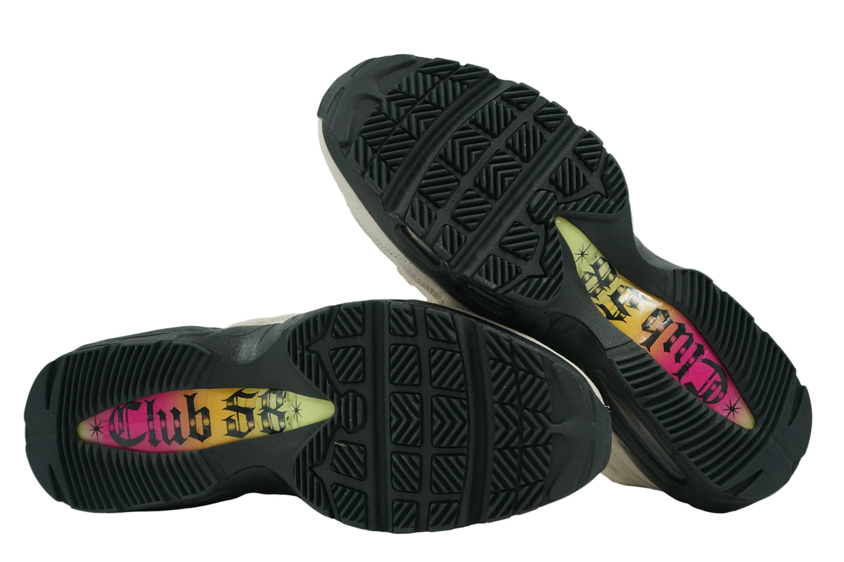 Black outsoles of Nike SB Air Max 95 Club 58 with pink, orange and yellow gradient Club 58 graphic