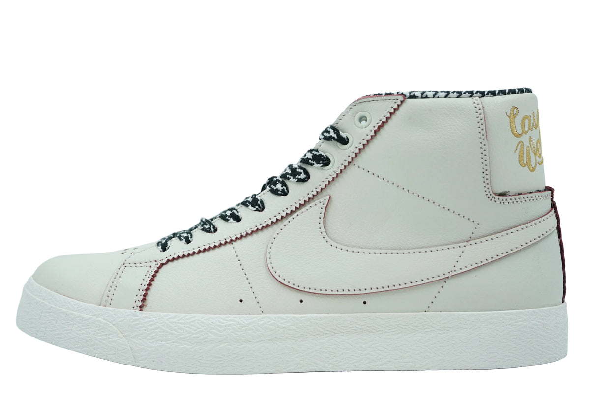 Nike SB Blazer Mid in sail leather with burgundy zig-zag stitching, houndstooth laces and gold heel script, side view