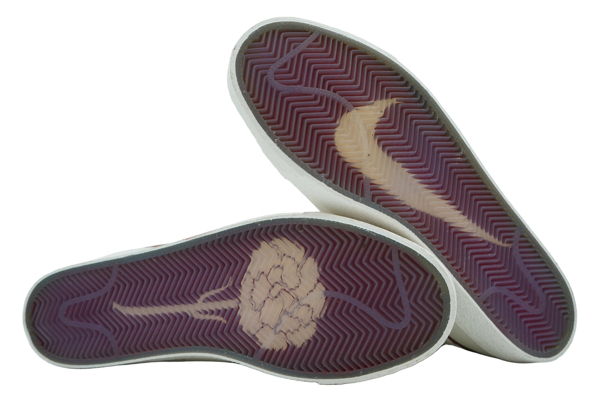 Outsoles of Nike SB Blazer Mid Casa Welcome Madrid with translucent burgundy herringbone, Swoosh and carnation graphic