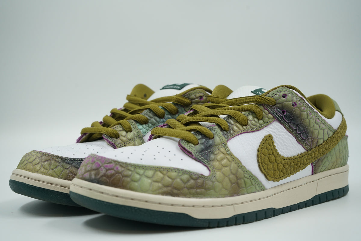 Pre-owned pair of Alexis Sablone x Nike SB Dunk Low Chameleon with green reptile overlays and olive laces, front view