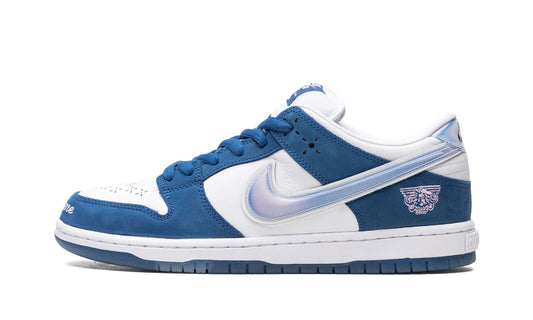 Nike SB Dunk Low x Born x Raised featuring deep royal blue nubuck overlays, a holographic Swoosh, and 'One Block at a Time' embroidered on the toe. Exclusive collaboration available at our Malmö store or order online now.